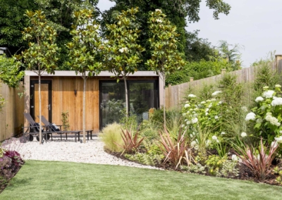 Garden design in Friern Road, Dulwich, 1 Pebbled lounge area at rear in front of summer house