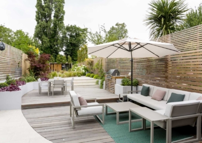 Back garden design in Friern Road, Dulwich, 7 Decked sitting and dining areas with integrated barbecue