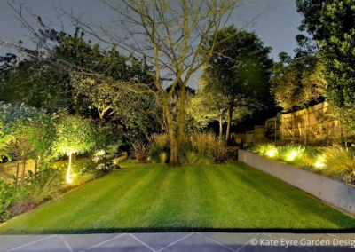 Large back garden design in Crystal Palace, South London, 10: evening view
