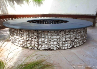 Gabion fire-pit in a garden design in Crystal Palace, London